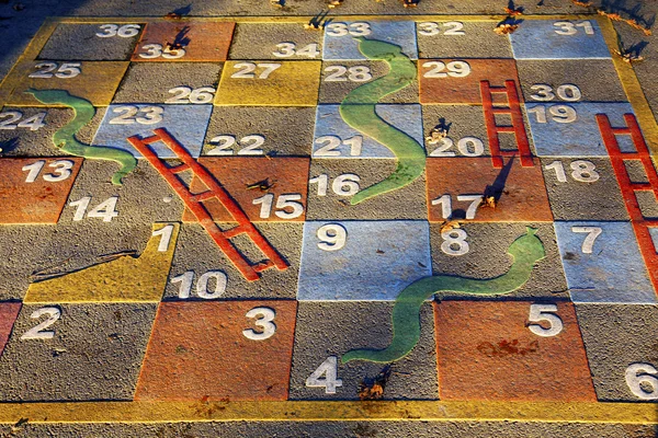 Large outdoor snakes and ladders game — Stock Photo, Image