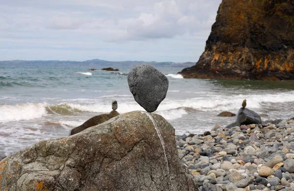 Stones balanced on a pebble beach — Stock Photo, Image