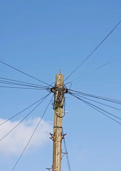 Telegraph pole against blue sky — Stock Photo, Image