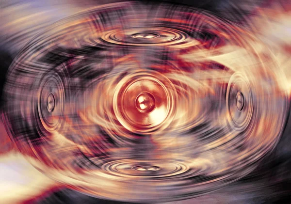 Music speakers on a swirling background — Stock Photo, Image