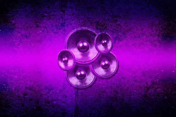 Purple music speakers on a concrete wall — Stock Photo, Image
