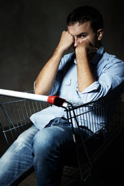 Guy in shopping cart — Stock Photo, Image