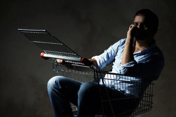 Guy in shopping cart — Stock Photo, Image