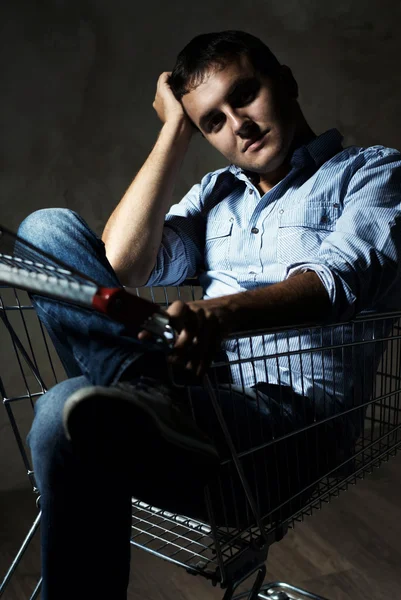 Guy in shopping cart — Stock Photo, Image