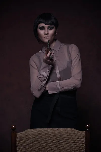 Beautiful girl smoking pipe — Stock Photo, Image