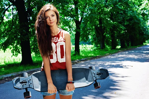 Urban girl with longboard — Stock Photo, Image