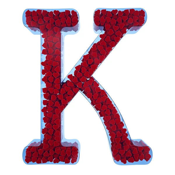 Letter of K from blue glass. Filled with red hearts from a velve — Stock Photo, Image