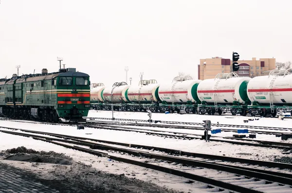 Freight train passing the railway station — Stock Photo, Image