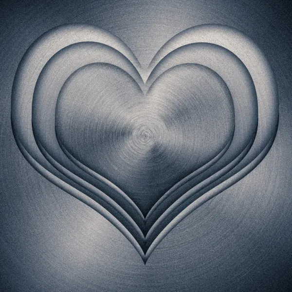 Heart, stamped into polished metal — Stock Photo, Image