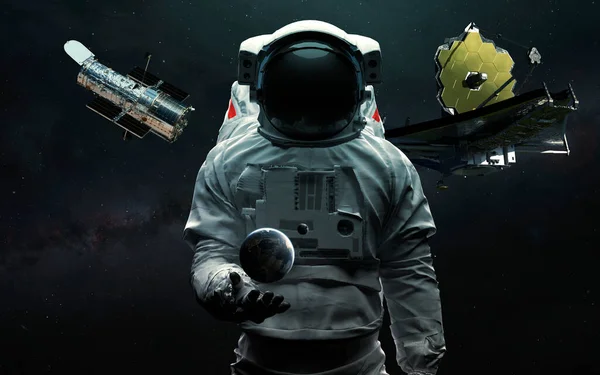 Astronaut en twee telescopen James Webb en Hubble. JWST lanceer kunst. Elementen van beeld geleverd door Nasa — Stockfoto