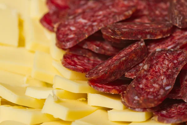 Sliced meat appetizers and cheese — Stock Photo, Image