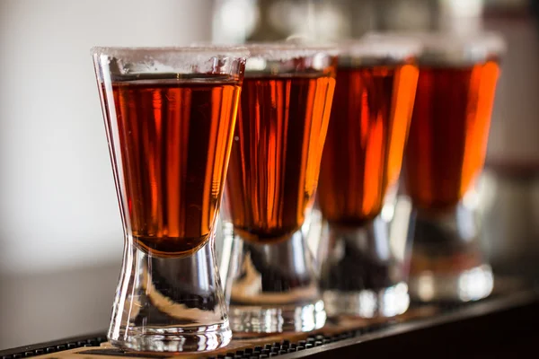 Shots with liquor and salt in cocktail club — Stock Photo, Image