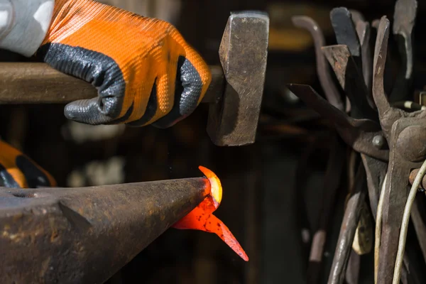 Smith forging hot iron — Stock Photo, Image