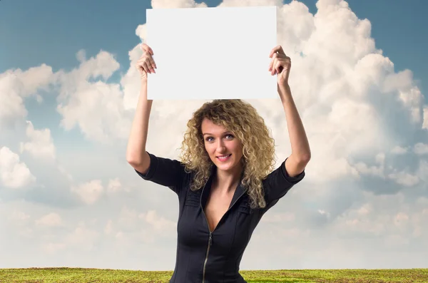 Business woman with blank poster — Stock Photo, Image