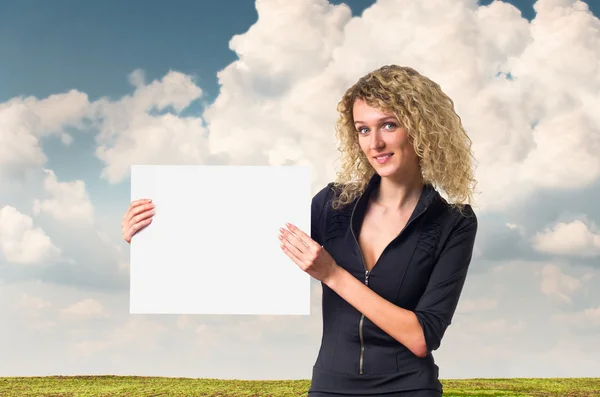 Business woman with blank poster — Stock Photo, Image