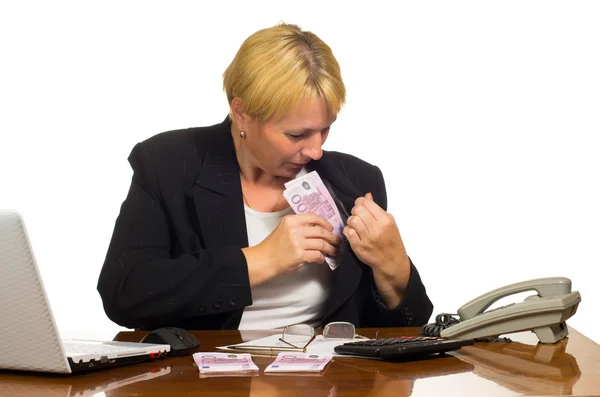 Mature businesswoman hides money — Stock Photo, Image