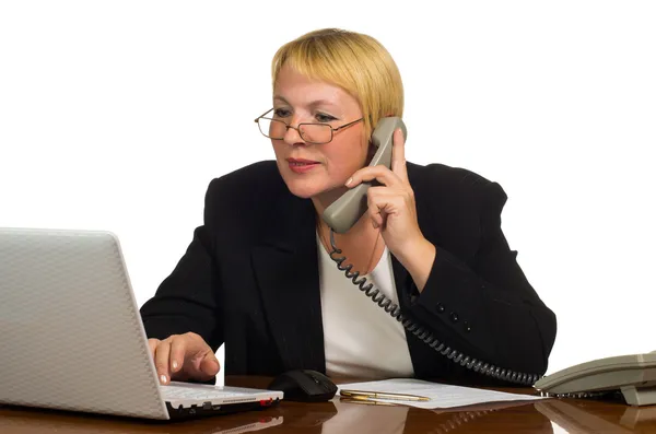 Mature businesswoman calling on the phone and check something on — Stock Photo, Image