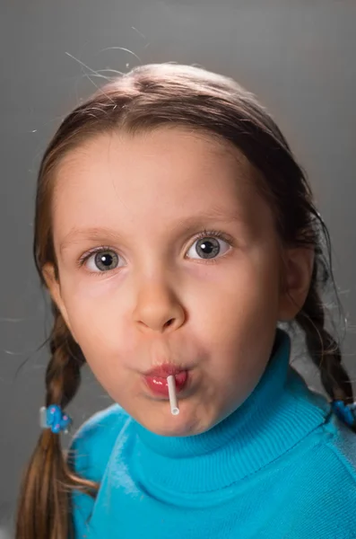 Little girl with lollipop . — Stock Photo, Image