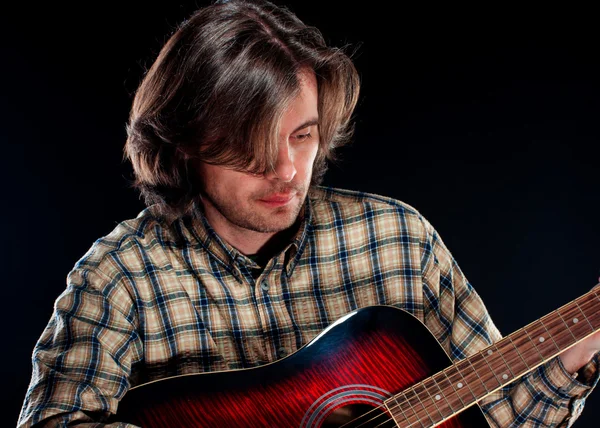 Guitarist plays on a guitar — Stock Photo, Image