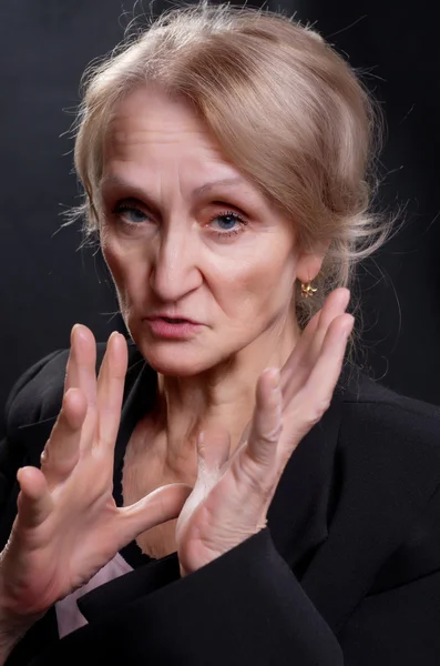 Mature woman gesticulate — Stock Photo, Image