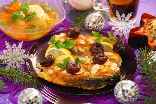 Fried carp with almonds and prune for christmas — Stockfoto