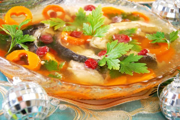 Carp in jelly with carrot and cranberry for christmas — Stock Photo, Image