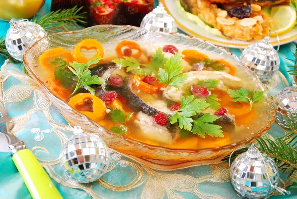 Carp in jelly with carrot and cranberry for christmas — Stock Photo, Image