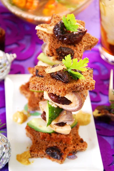 Herring canapes with prune and gherkin for christmas — Stock Photo, Image