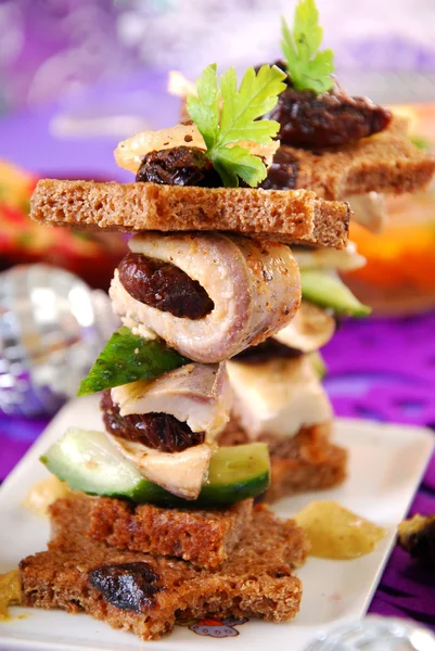 Herring canapes with prune and gherkin for christmas — Stock Photo, Image