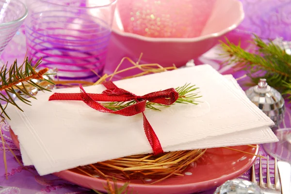 Table with christmas eve wafer on the plate with hay — Stock Photo, Image