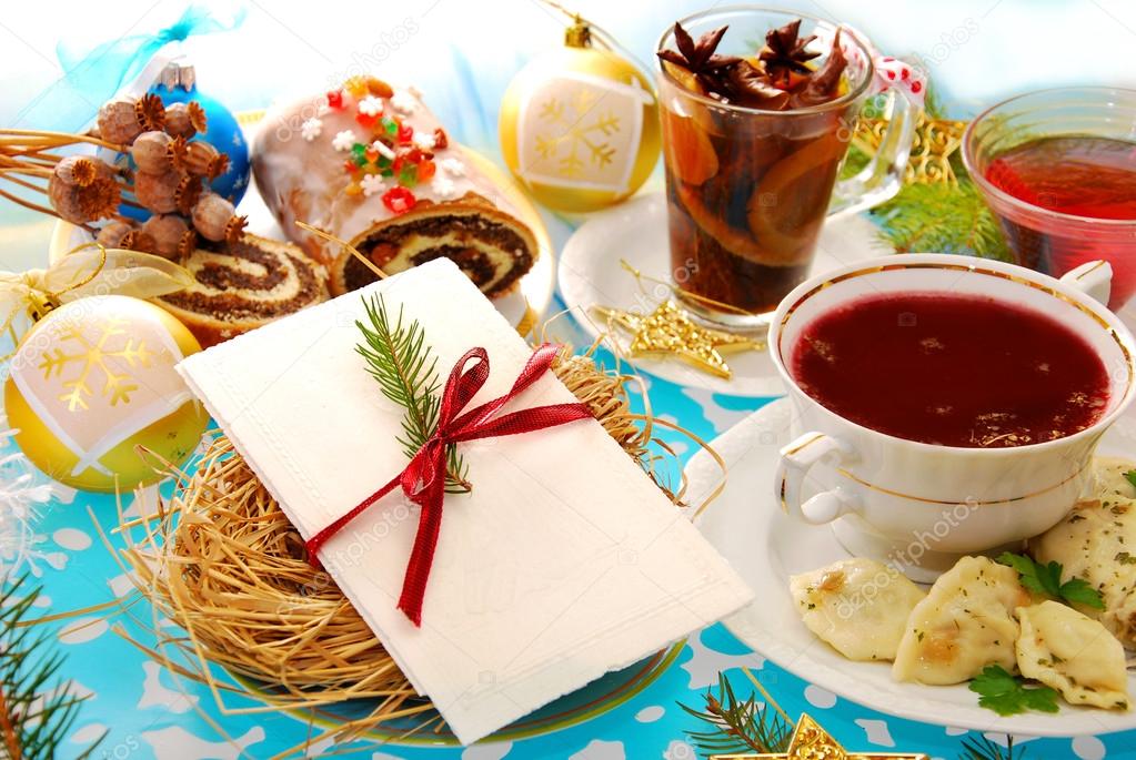 Christmas eve table with wafer and traditional dishes