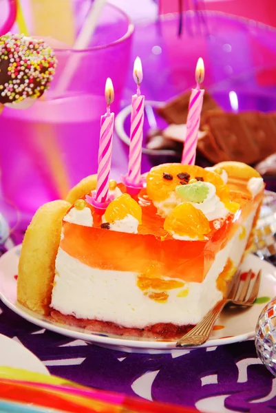 Cake with three candles on birthday party table for child — Stock Photo, Image