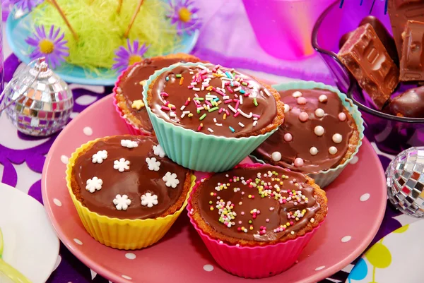 Homemade muffins on birthday party table — Stock Photo, Image