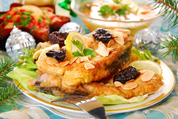 Breaded carp with almonds and prune for christmas — Stock Photo, Image