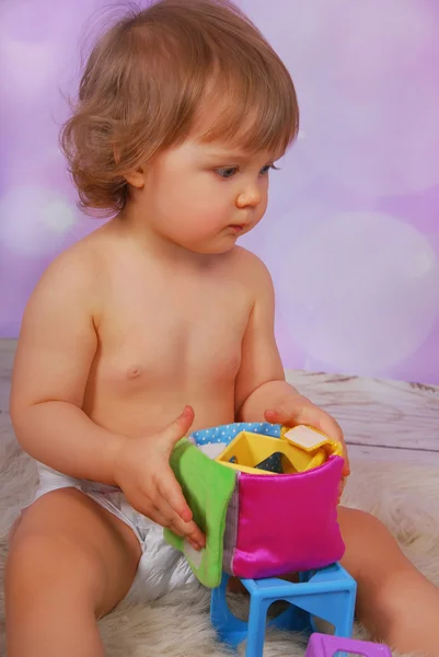 Little baby girl playing with education toy — Stock Photo, Image