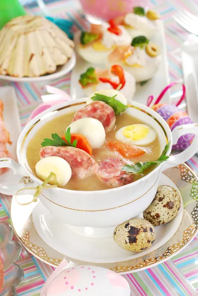 Easter white borscht with quail eggs and sausage — Stock Photo, Image