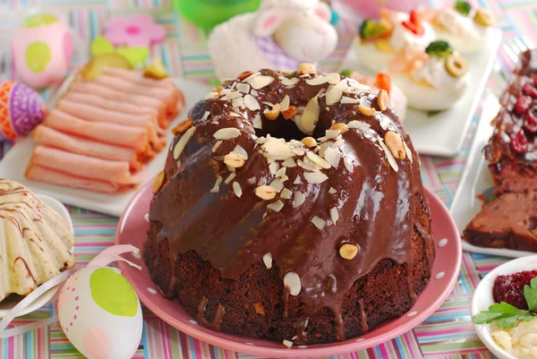 Chocolate ring cake with almonds and nuts for easter — Stock Photo, Image