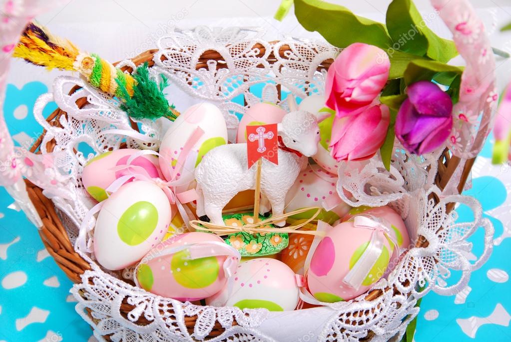 easter basket with eggs and sheep figurine