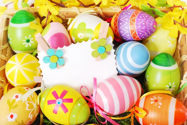 Background with easter painted eggs and greeting card — Stock Photo, Image