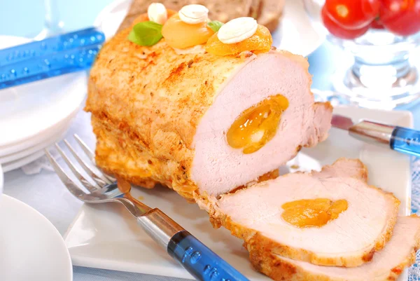 Roasted pork loin with apricots and almonds — Stock Photo, Image