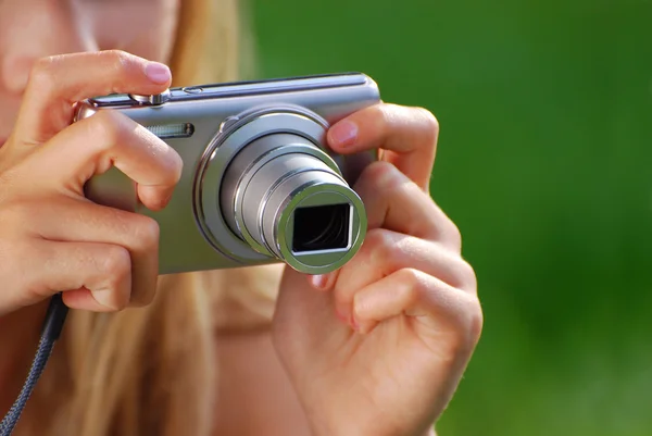 Young girl taking photos by digital camera — Stock Photo, Image