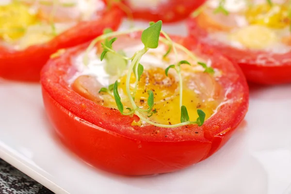 Tomato stuffed with quail egg — Stock Photo, Image