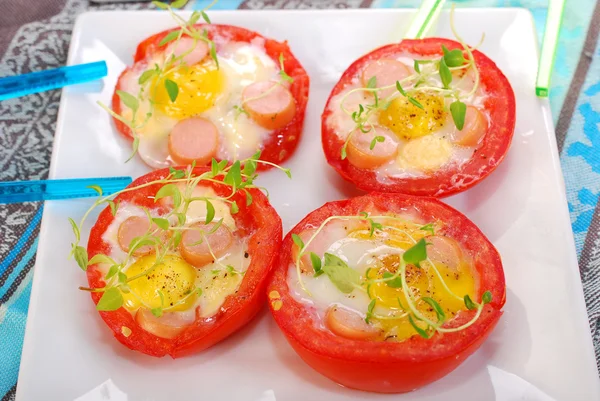 Tomato stuffed with quail egg — Stock Photo, Image