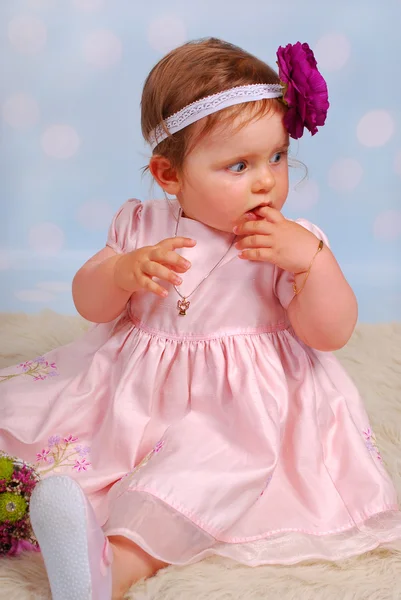 Lovely little baby girl with flower — Stock Photo, Image