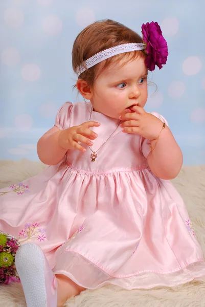 Lovely little baby girl with flower Stock Photo