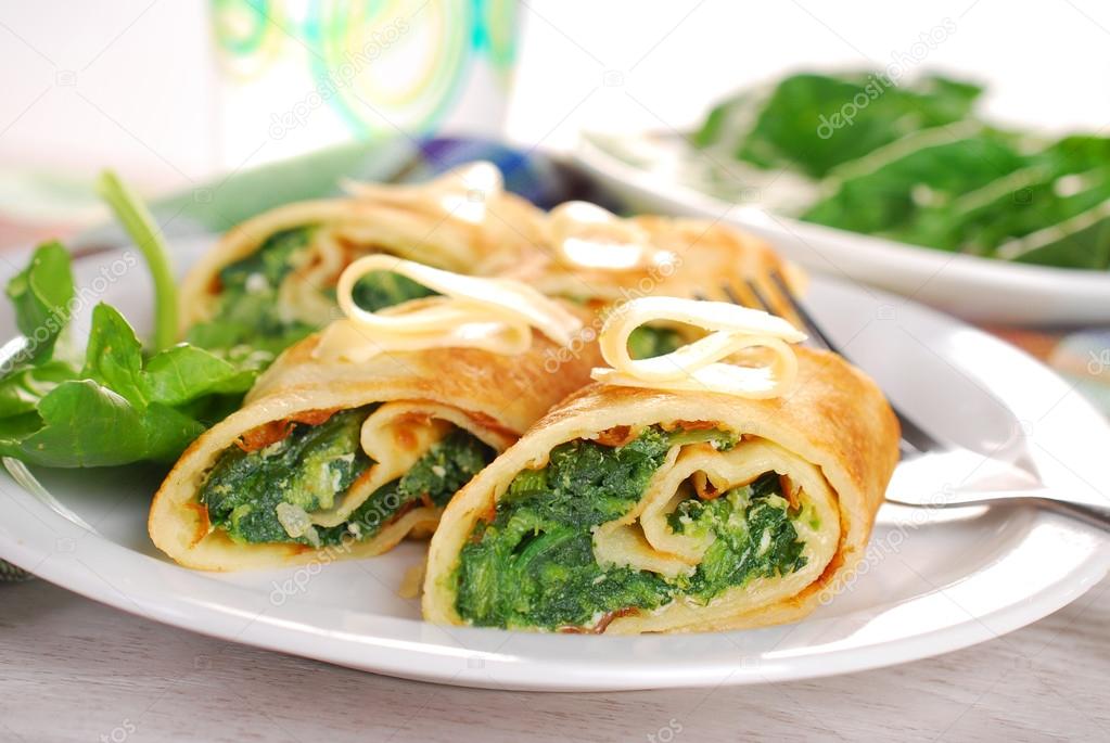 rolled spinach pancakes cut into small pieces