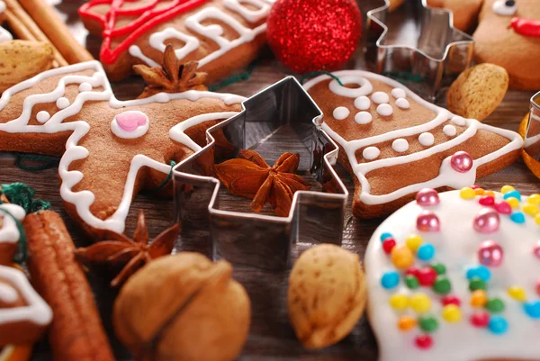 Christmas background with gingerbread cookies ,cutters and spice — Stock Photo, Image