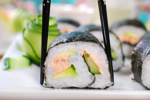 Maki sushi rolls with salmon and avocado — Stock Photo, Image