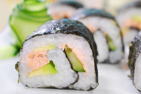 Maki sushi rolls with salmon and avocado — Stock Photo, Image