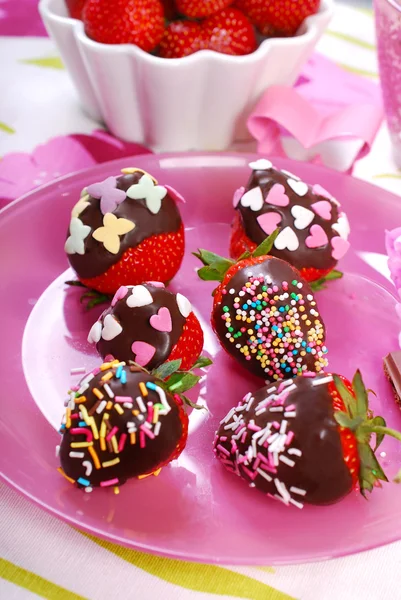 Chocolate covered fresh strawberries with colorful sprinkles — Stock Photo, Image